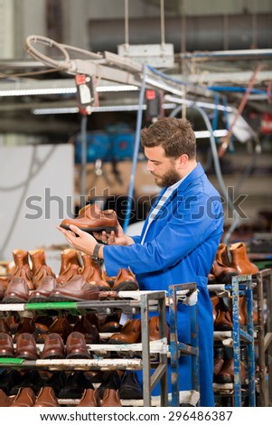 Young man in shoes factory.