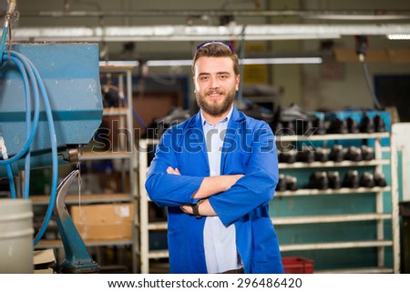 Young man in shoes factory.