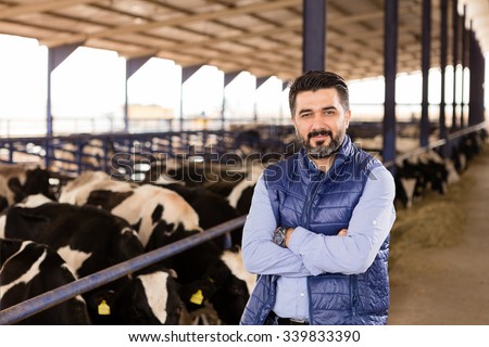 Young farmer in animal farm.