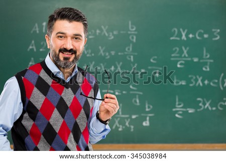 Young teacher in classroom.