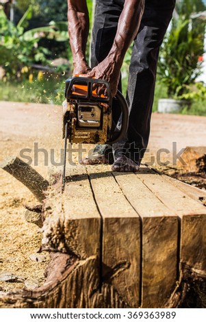 Focus carpenter sawing wood