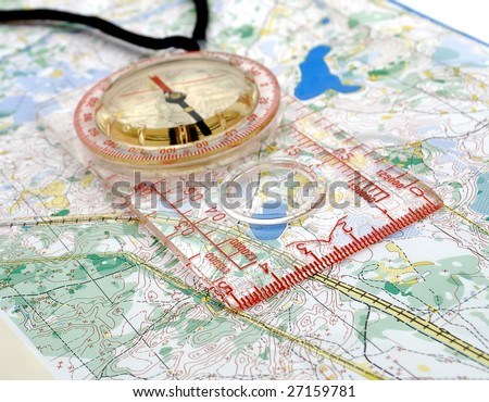 The big compass on a sports map for orientation
