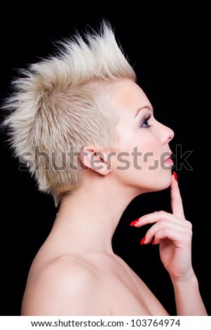 beautiful young woman profile portrait against black background