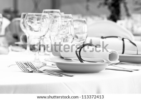 wedding table set for fine dining or another catered event - black and white