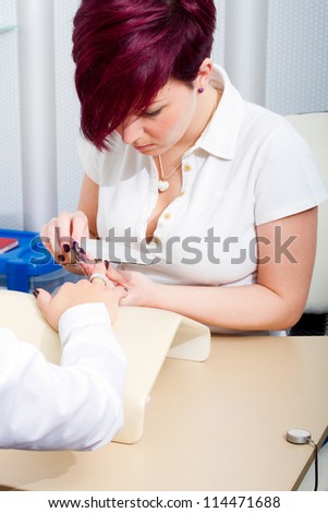professional manicure, care of fingers of hands, cleaning, covering a varnish of nails