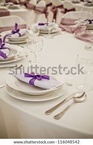 luxury place setting, purple napkin on plate - colorized photo