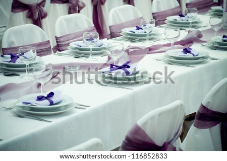 wedding tables set for fine dining or another catered event - colorized photo