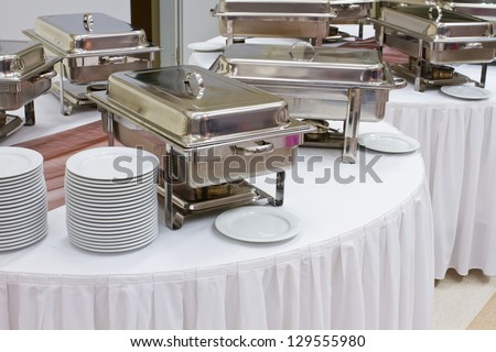 metal kitchen equipments on the table for fine wedding dining or another catered event