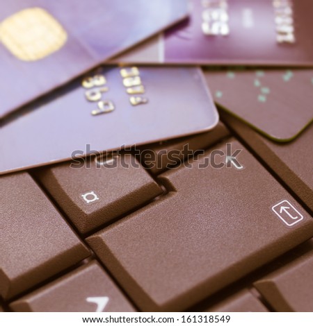 credit cards on keyboard - e-commerce concept