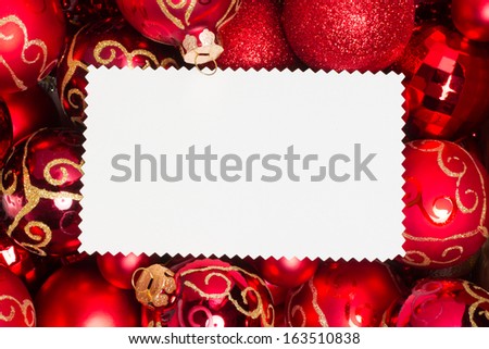 christmas ornaments, red balls and text area on blank xmas card