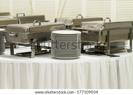 metal kitchen equipments on the table for fine wedding dining or another catered event