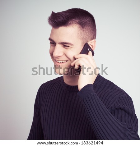 portrait of happy man calling by mobile phone - colorized photo
