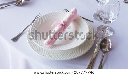 table set for a wedding dinner, napkin on plate