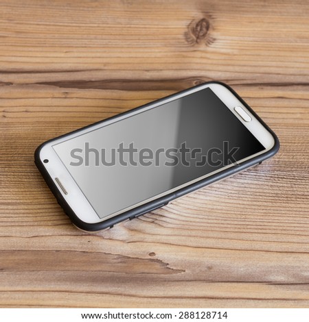 single smart phone on vintage grunge wooden table