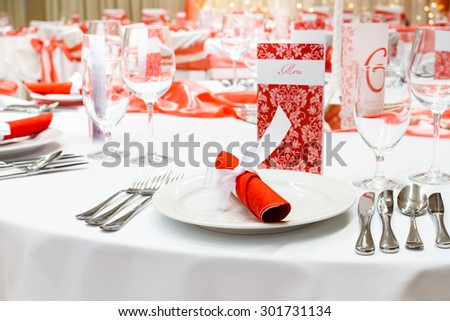 wedding tables set for fine dining or another catered event, red decoration