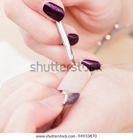 manicure stage: painting flower on nail