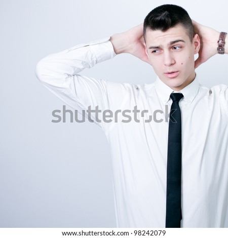 portrait of a young business man looking depressed from work