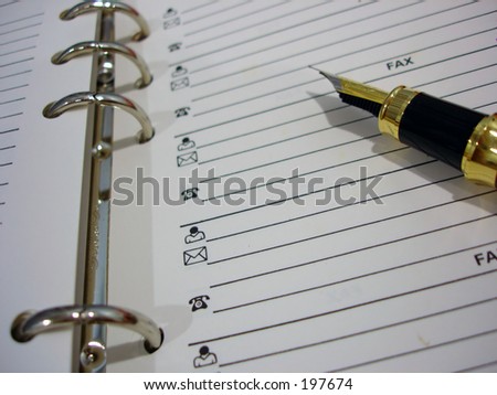 Address book with pen