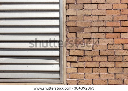 Architecture detail. Old brick wall with window blinds. Outdoor