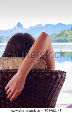 Woman relaxing on beach, ocean view with concept the Award of life with stay and relax the mind.