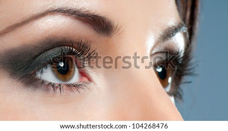 Beautiful woman eyes close-up with make up