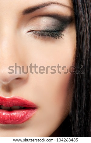 woman's face with make-up with closed eyes
