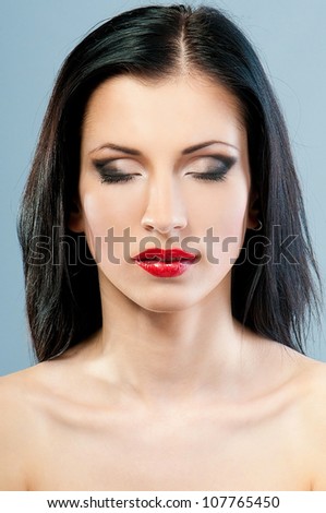 woman's face with make-up with closed eyes