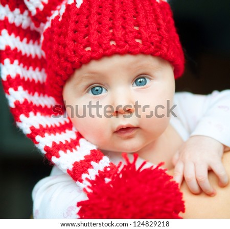pretty infant in red hat