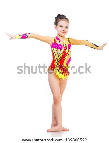 Beautiful little girl gymnast isolated on a white background