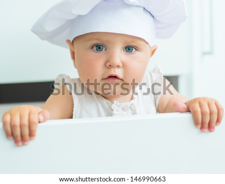 beautiful baby in chef\'s hat