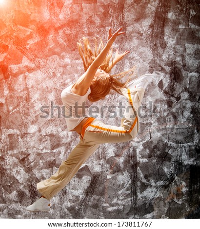 jumping girl on a gray grunge background