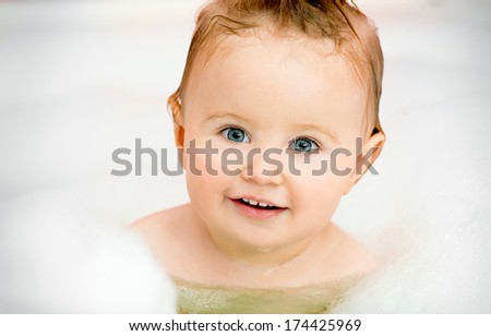 smiling face of a little baby in the bathroom