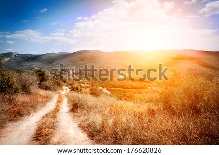 landscape with Country road against sunset