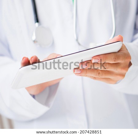 doctor works with a tablet pc