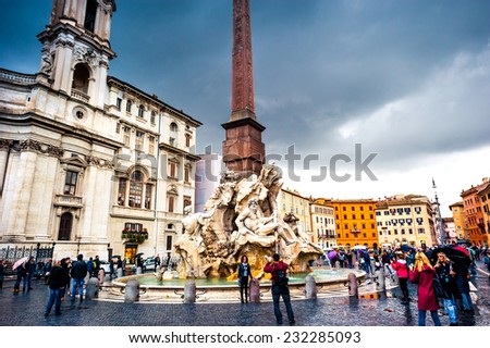 Rome, Italy - November 17, 2014: Tourists visit Piazza Navona with fountain  in Rome, Italy. Rome is of the most visited city in Europe and world