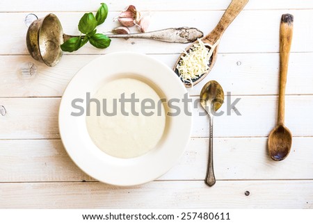 onion soup puree in a white plate  on the table