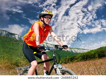 Young female riding a mountain bike outdoor