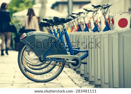 row of bicycles for city bike hire on a street