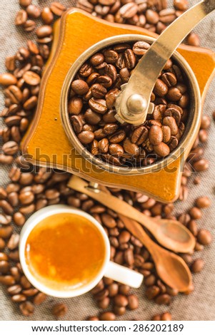 Closeup of coffee beans with focus coffee beans on coffee grinder