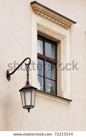 The Wall of Wawel Castle. Wall with window and street lamp.