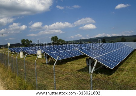 Solar panel in the field fenced in a rusty barbed wire near Sofia