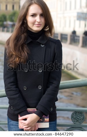 Young beautiful woman with book and her \
