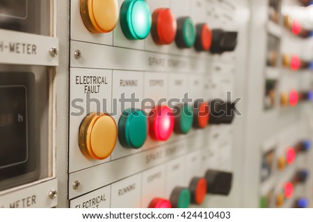 Soft focus electrical fault lighting on control panel board.
