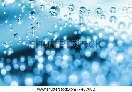 shining water droplets  looking as decorations with bokeh effect; winter &  new year theme
