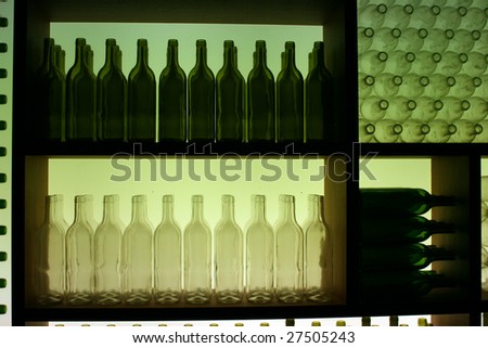 Display of Green and White Bottles