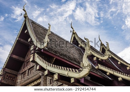 Thai art style at roof top of Buddhist temple with gable apex in Chiangmai, Thailand