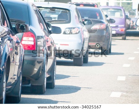 Cars line up against a detour caused by a fatal accident on the highway during rush hour