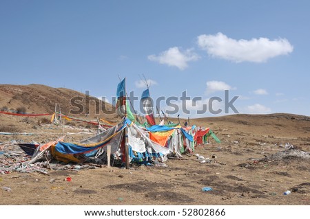 the prayer flags on the top of the hill is fluttering in the wind