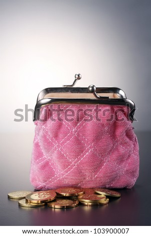 Women  purse filled up  with coins