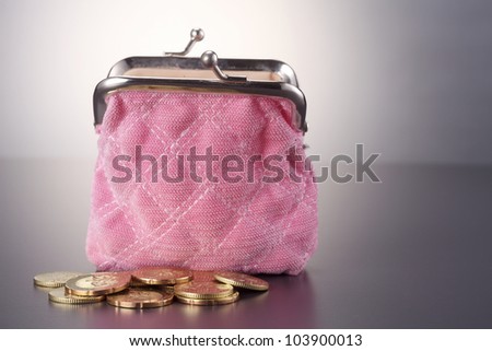 Women  purse filled up  with coins